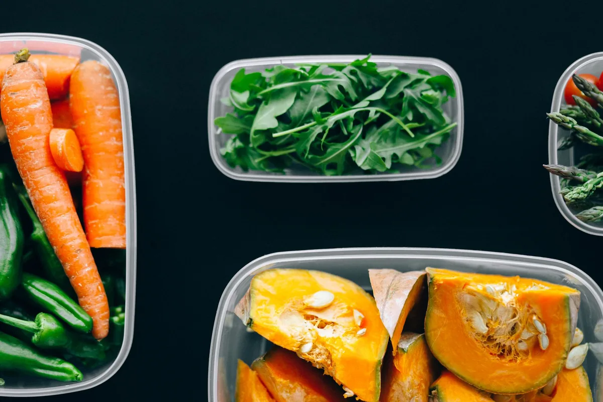 Prepared meals portioned into containers with vegetables and rice