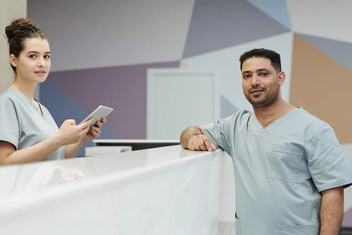 Staff at a clinic reception desk