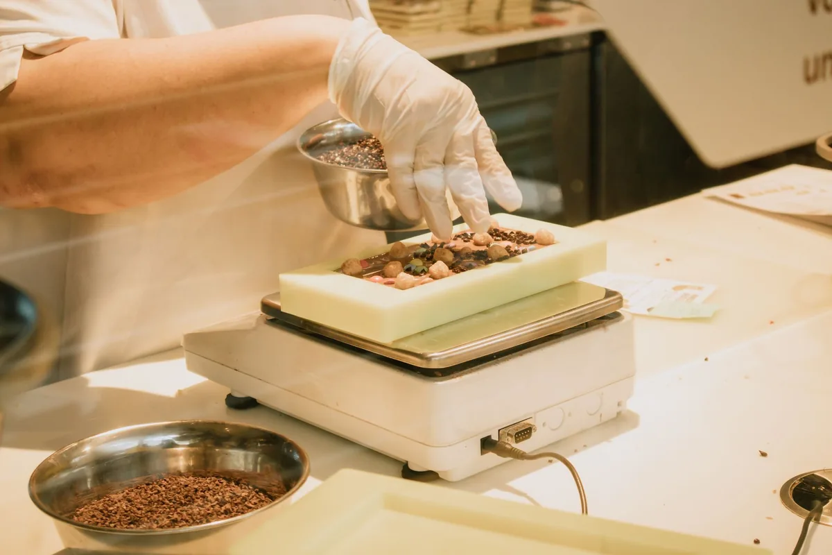 Ingredients being weighed on a kitchen scale