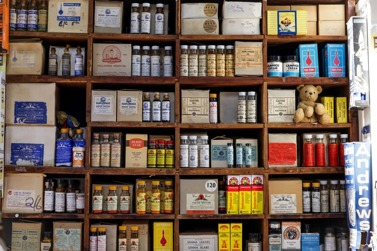 Shelves of medicine boxes in a pharmacy
